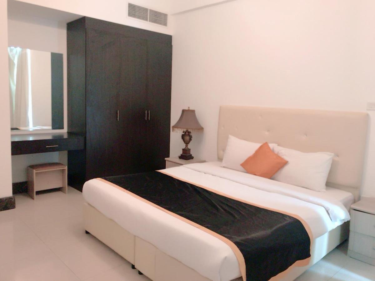 Stout Apartments Manama Rum bild